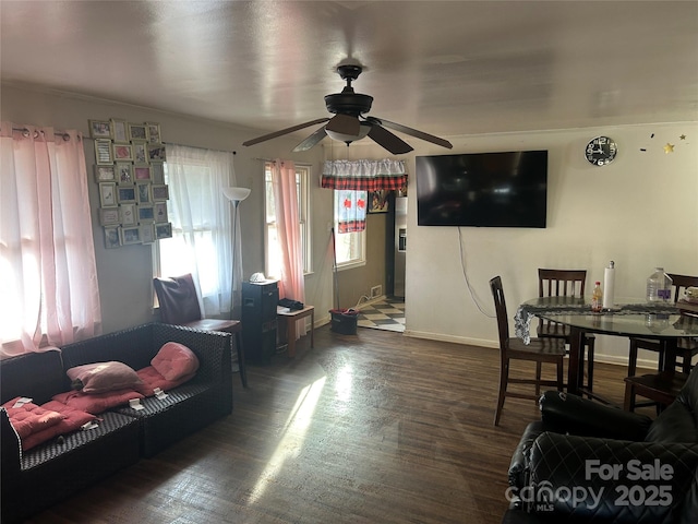 living room with ceiling fan and dark hardwood / wood-style floors