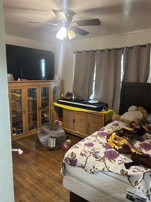 bedroom with ceiling fan and dark hardwood / wood-style floors