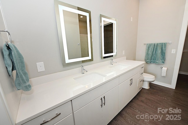 3630 N Davidson St, Charlotte, NC 28205 - bathroom with vanity, wood-type flooring, and toilet