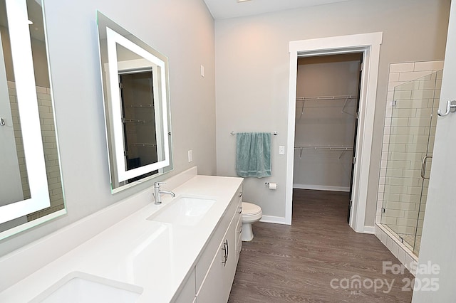 3630 N Davidson St, Charlotte, NC 28205 - bathroom featuring vanity, hardwood / wood-style floors, a shower with shower door, and toilet