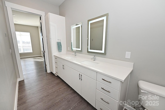 3630 N Davidson St, Charlotte, NC 28205 - bathroom with vanity, wood-type flooring, and toilet