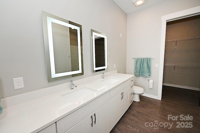 3630 N Davidson St, Charlotte, NC 28205 - bathroom with vanity, hardwood / wood-style floors, and toilet