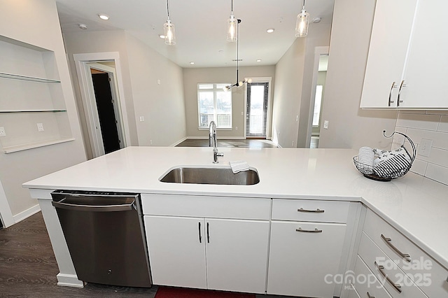 3630 N Davidson St, Charlotte, NC 28205 - kitchen featuring white cabinetry, stainless steel dishwasher, decorative light fixtures, and sink