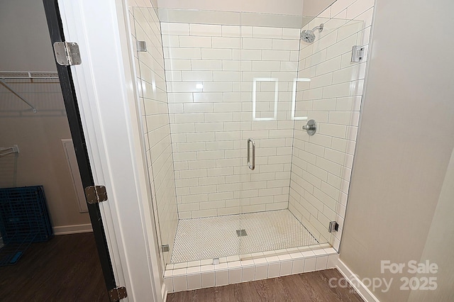 3630 N Davidson St, Charlotte, NC 28205 - bathroom featuring hardwood / wood-style floors and a shower with door