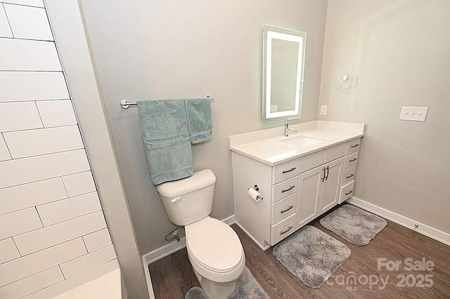 3630 N Davidson St, Charlotte, NC 28205 - bathroom with wood-type flooring, toilet, vanity, and a shower