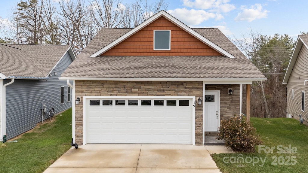 19 Sage Crest Loop, Weaverville, NC 28787 - view of front facade featuring driveway, stone siding, and a shingled roof