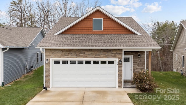 view of front of property with an attached garage, stone siding, concrete driveway, roof with shingles, and a front yard