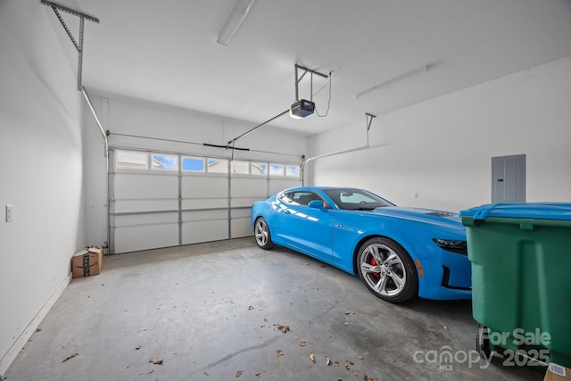 garage featuring a garage door opener and electric panel