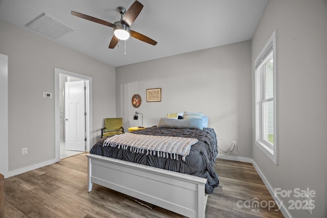 bedroom featuring hardwood / wood-style floors and ceiling fan