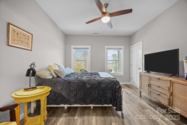 bedroom featuring wood-type flooring and ceiling fan