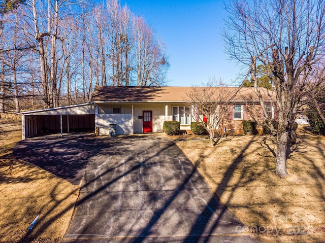 ranch-style home with a carport