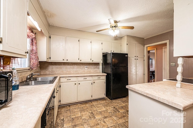 kitchen with sink, a textured ceiling, ceiling fan, and black appliances