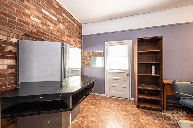 kitchen with brick wall