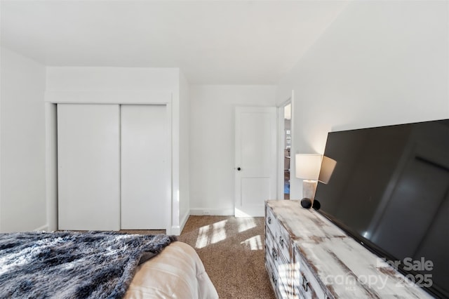 carpeted bedroom with a closet