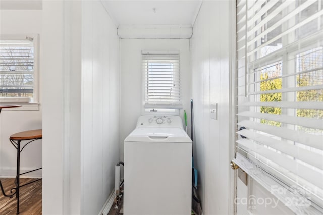 laundry room featuring hardwood / wood-style flooring, plenty of natural light, and washer / dryer