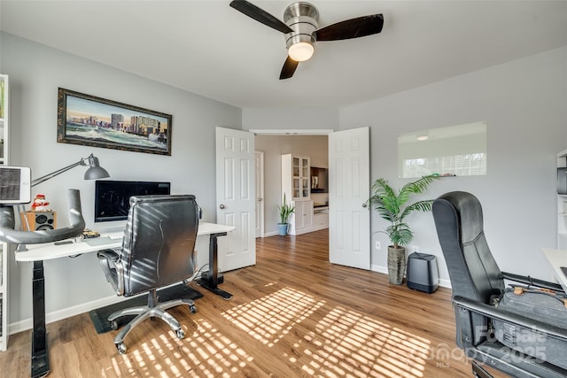 office area featuring hardwood / wood-style floors and ceiling fan