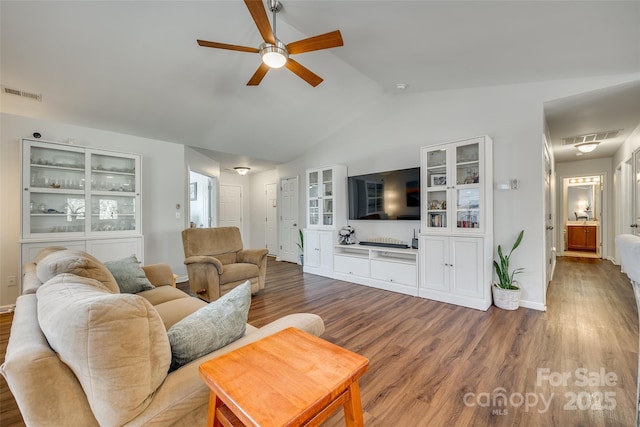 living room with hardwood / wood-style flooring, lofted ceiling, and ceiling fan