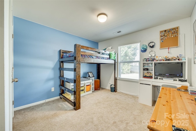 bedroom with light carpet