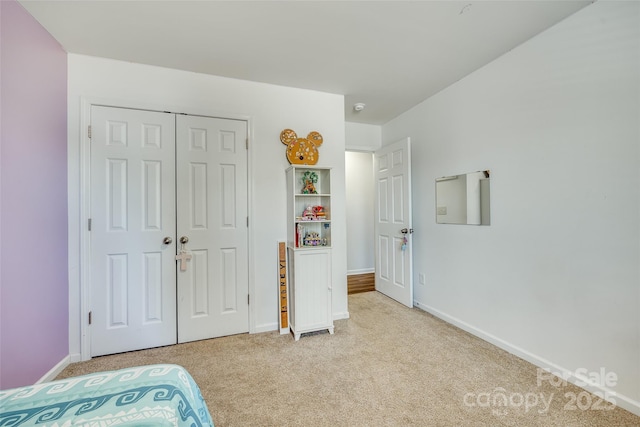 carpeted bedroom featuring a closet