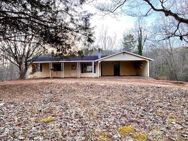 ranch-style house with a carport