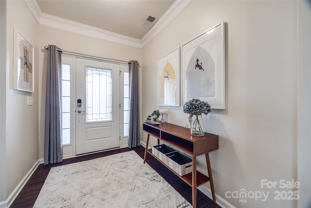 entrance foyer featuring ornamental molding and dark hardwood / wood-style flooring