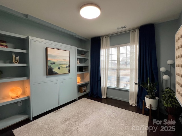 interior space with dark wood-type flooring