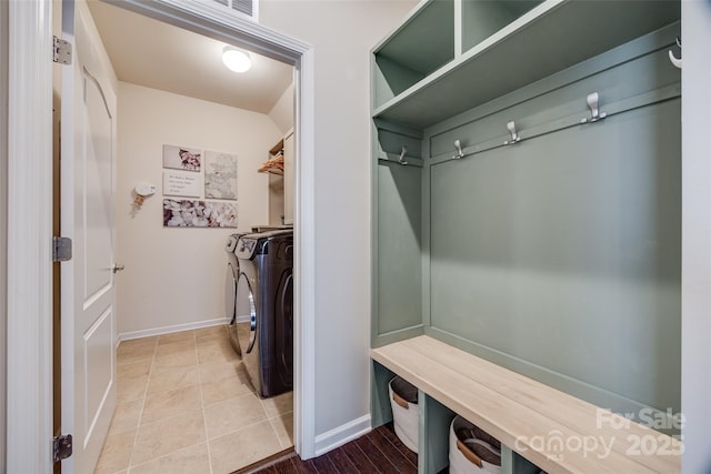 mudroom featuring tile patterned flooring and washer and clothes dryer