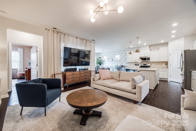 living room with dark hardwood / wood-style flooring