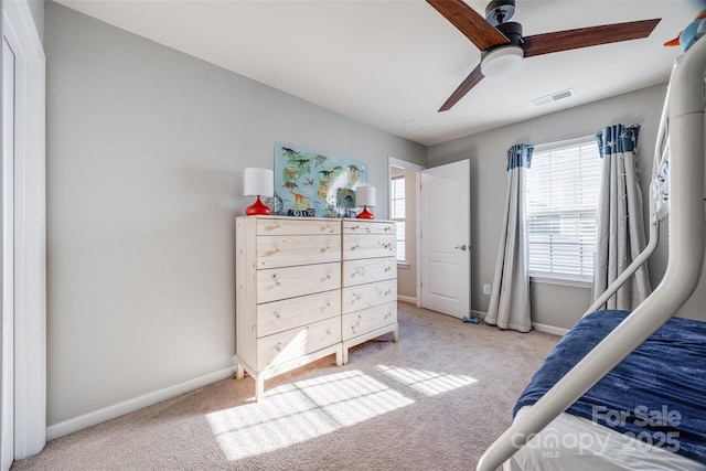 carpeted bedroom featuring ceiling fan