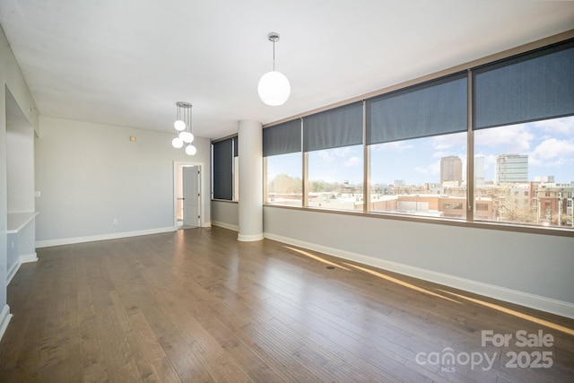 empty room with dark wood-type flooring