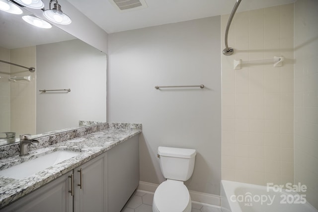 full bathroom with vanity, tiled shower / bath, tile patterned flooring, and toilet