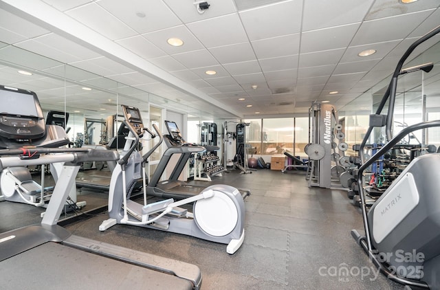 exercise room featuring a paneled ceiling