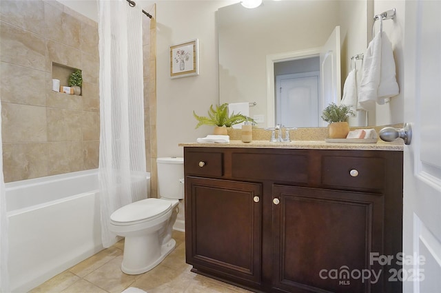 full bathroom featuring tile patterned flooring, vanity, toilet, and shower / bath combo