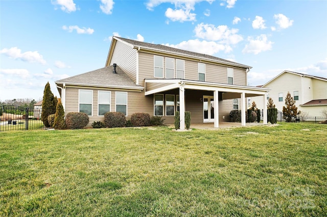 back of property featuring a yard and a patio area