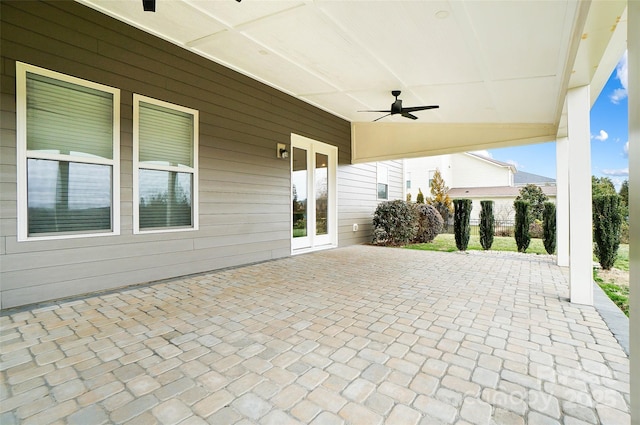 view of patio featuring french doors and ceiling fan