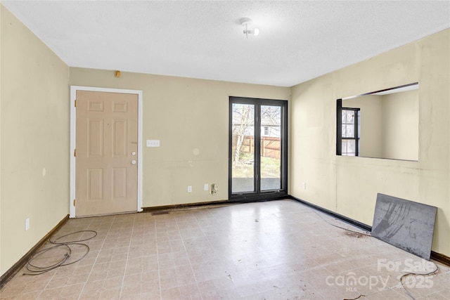 spare room featuring a textured ceiling