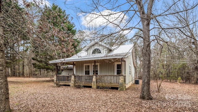 view of front of house with covered porch and central air condition unit