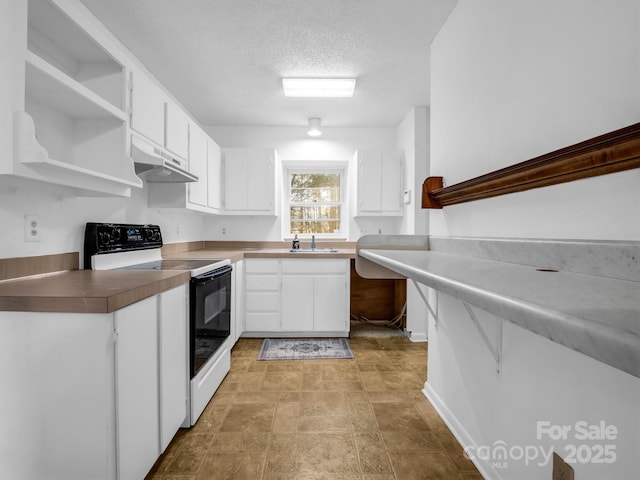 kitchen with white cabinetry, sink, a textured ceiling, and electric range