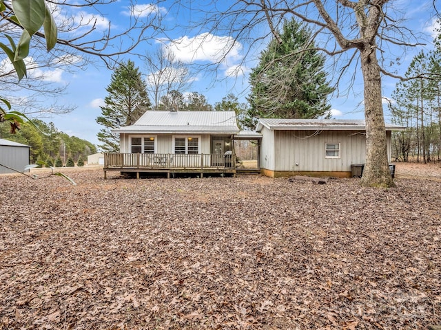 back of property with a wooden deck