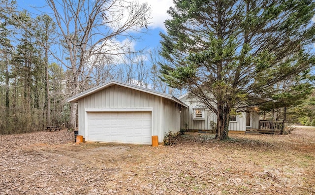 view of front of house featuring a garage and an outdoor structure