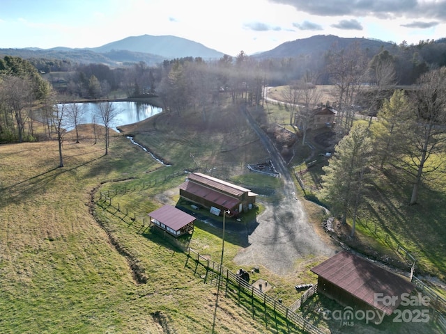 bird's eye view featuring a water and mountain view and a rural view