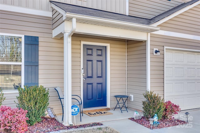 view of exterior entry featuring a garage