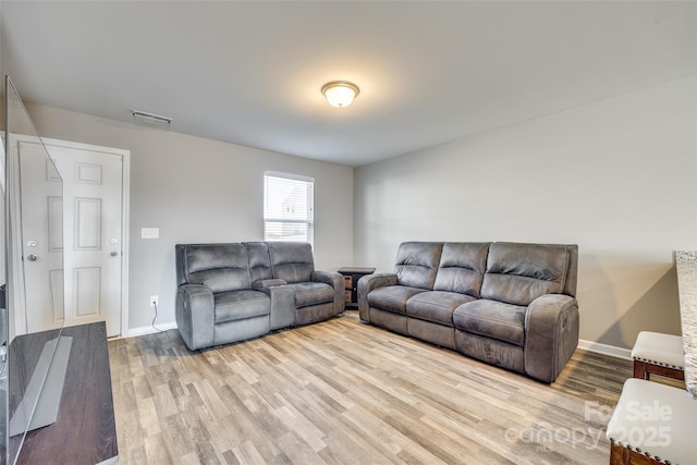 living room with light hardwood / wood-style flooring