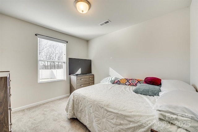 bedroom featuring light colored carpet