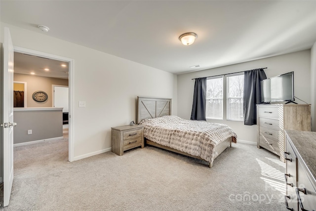 bedroom with light colored carpet