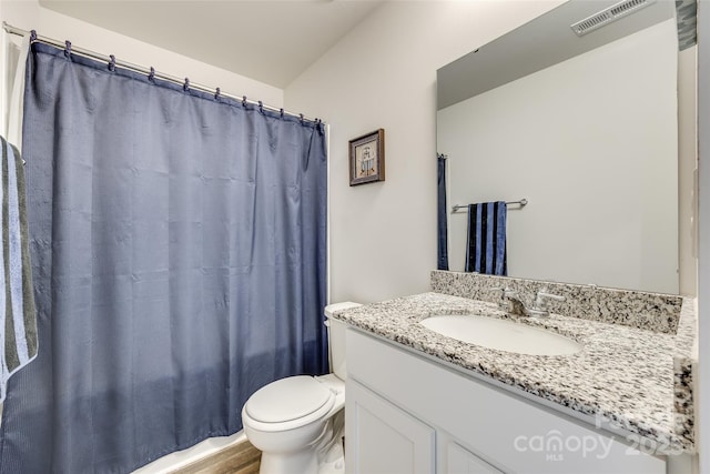 full bathroom featuring vanity, toilet, and shower / bath combo