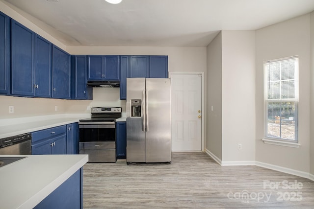 kitchen featuring light hardwood / wood-style flooring, stainless steel appliances, and blue cabinetry