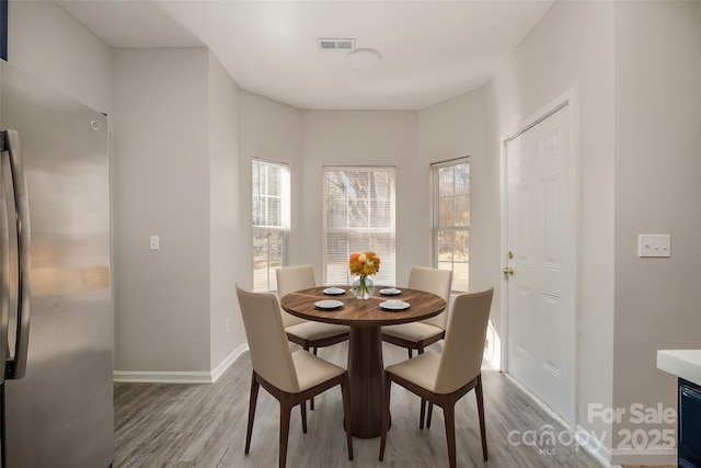 dining room with light wood-type flooring