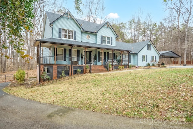 country-style home featuring a porch, a carport, and a front yard