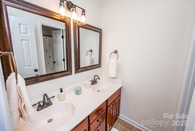 bathroom with vanity and tile patterned flooring